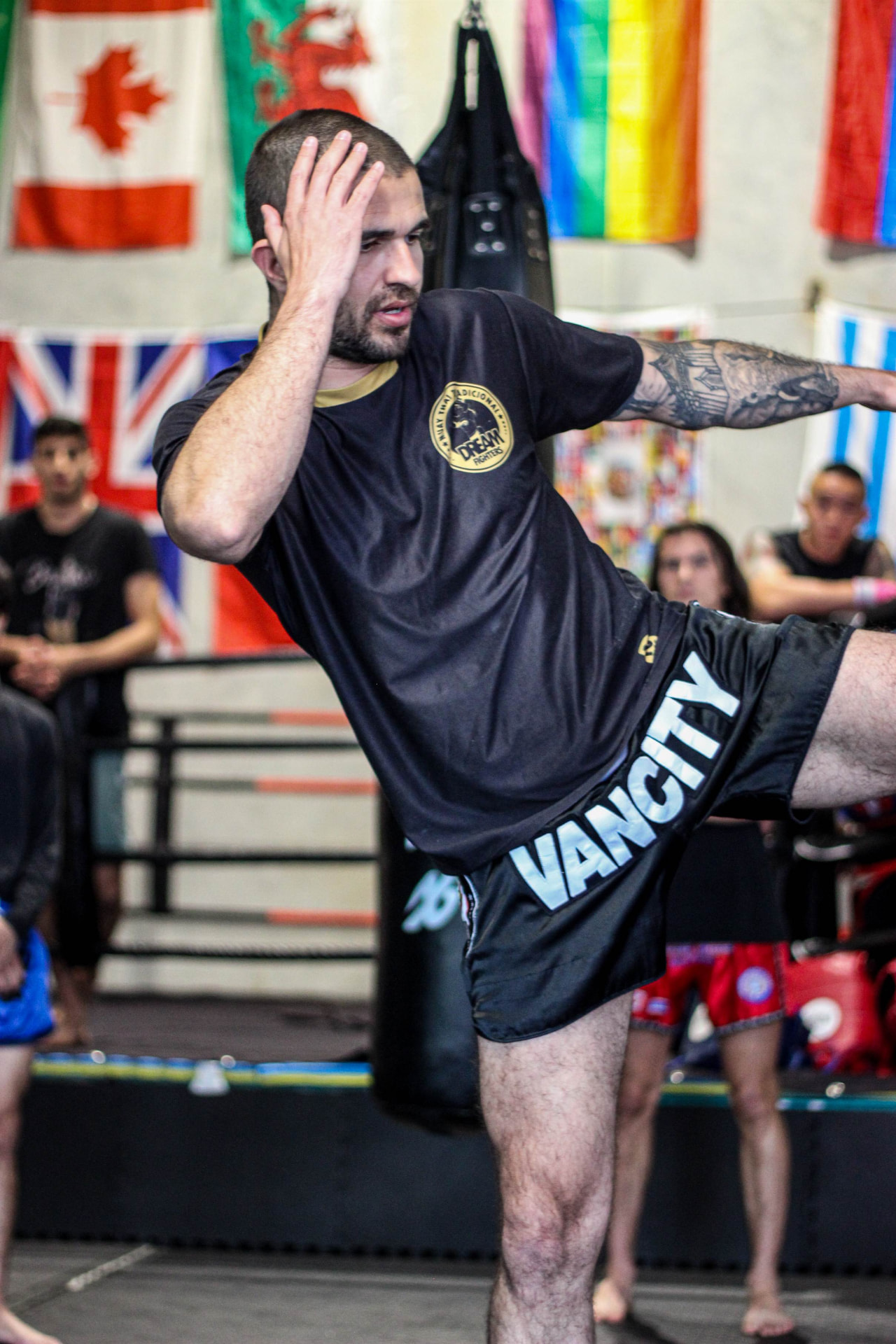 Dream Fighters Canada student throwing a Muay Thai kick during training at PTT Vancity