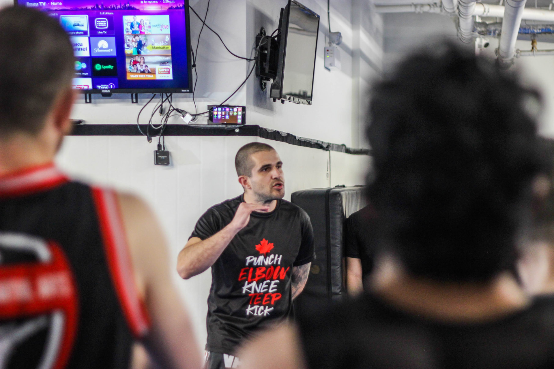 Kru Pedro breaking down a Muay Thai technique for the class