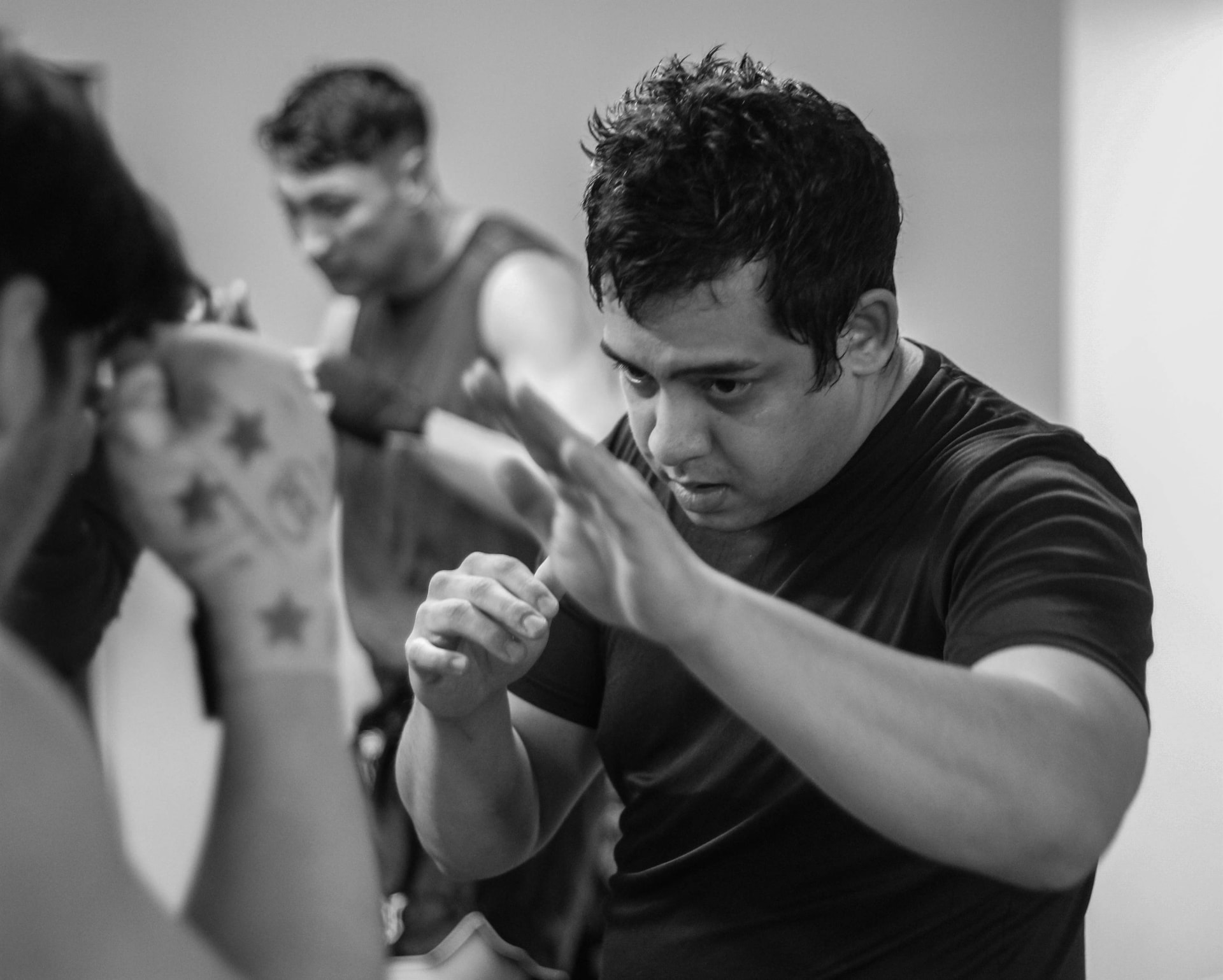 Student drilling guard and hand positioning during class