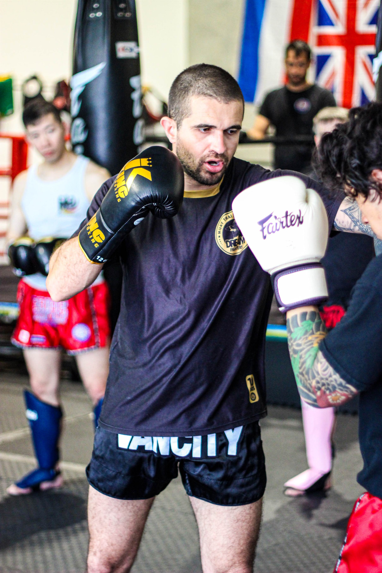 Kru Pedro coaching Muay Thai technique during a class at PTT Vancity